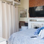 Close-up view of the Bourbon Room bed and TV.