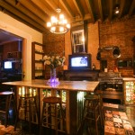 Granite topped island with bar stools in the grand kitchen.