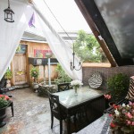 Outdoor large table under see-through ceiling.