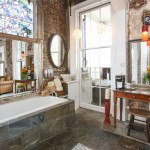 Jacuzzi tub, vanity, and, floor to ceiling window.